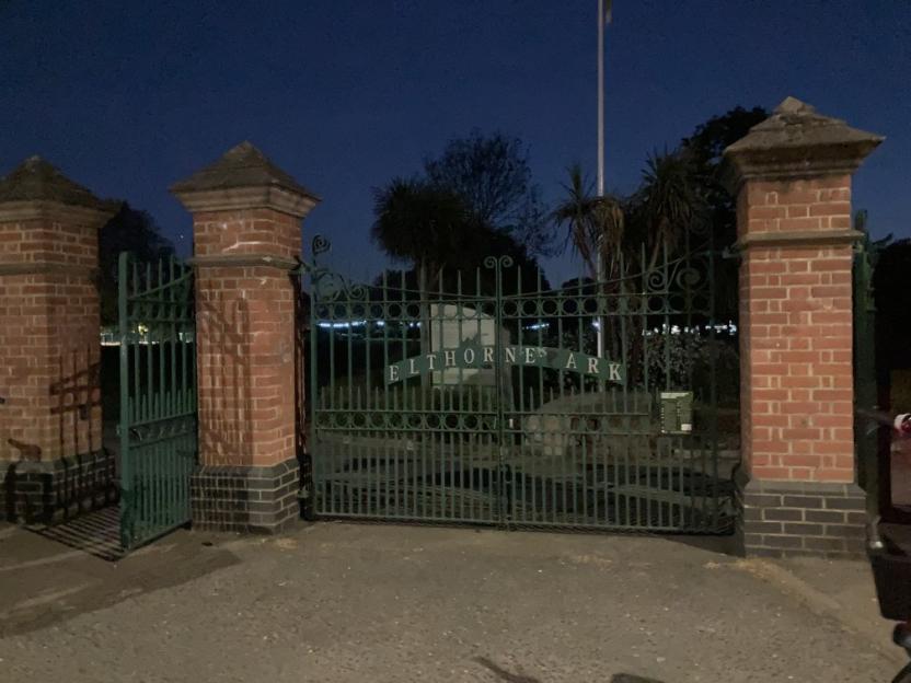 Elthorne Park entrance gate at dusk.