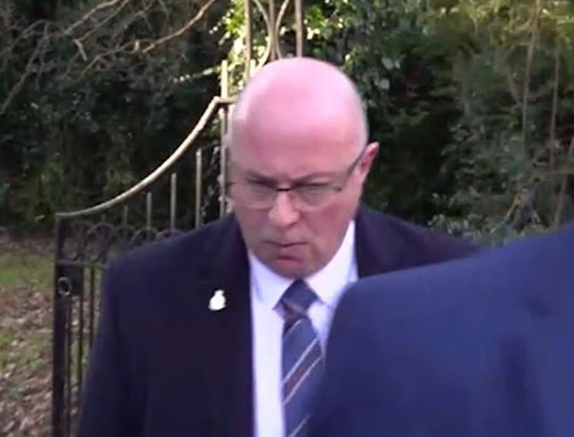 Police officer Mark Roberts in a suit and tie.