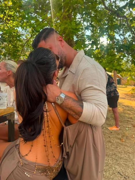 Chloe Brockett embracing a man.