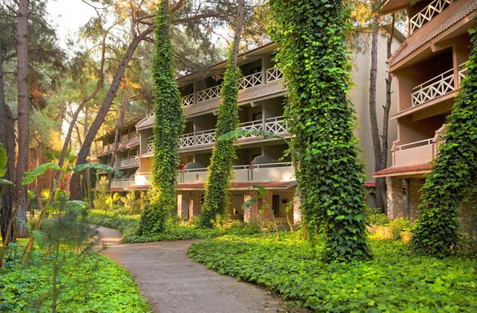 Marti Myra Hotel in Turkey surrounded by lush green foliage and trees.