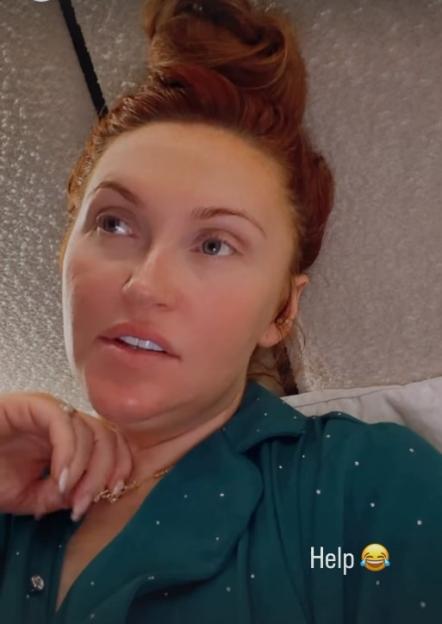 Charlotte Dawson, with red hair in a bun and wearing green pajamas, looking thoughtful with the caption 'Help 😂'.