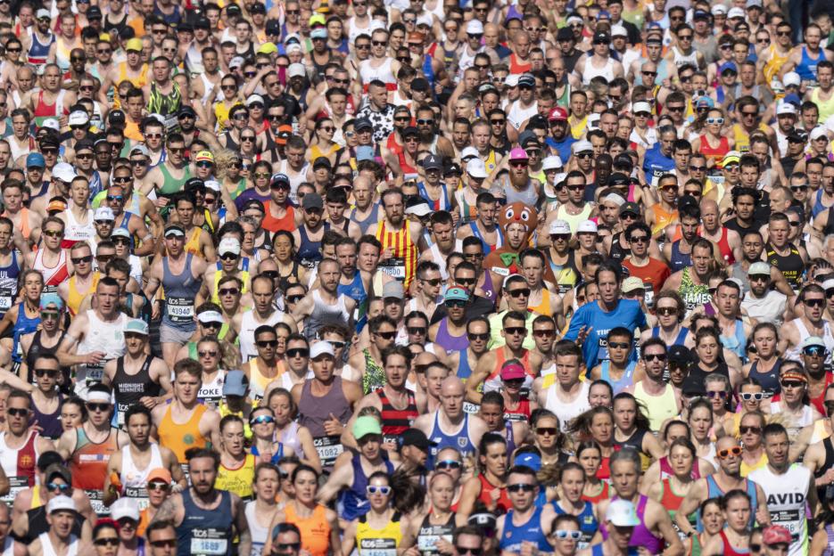 A large crowd of runners competing in the 2026 TCS London Marathon.