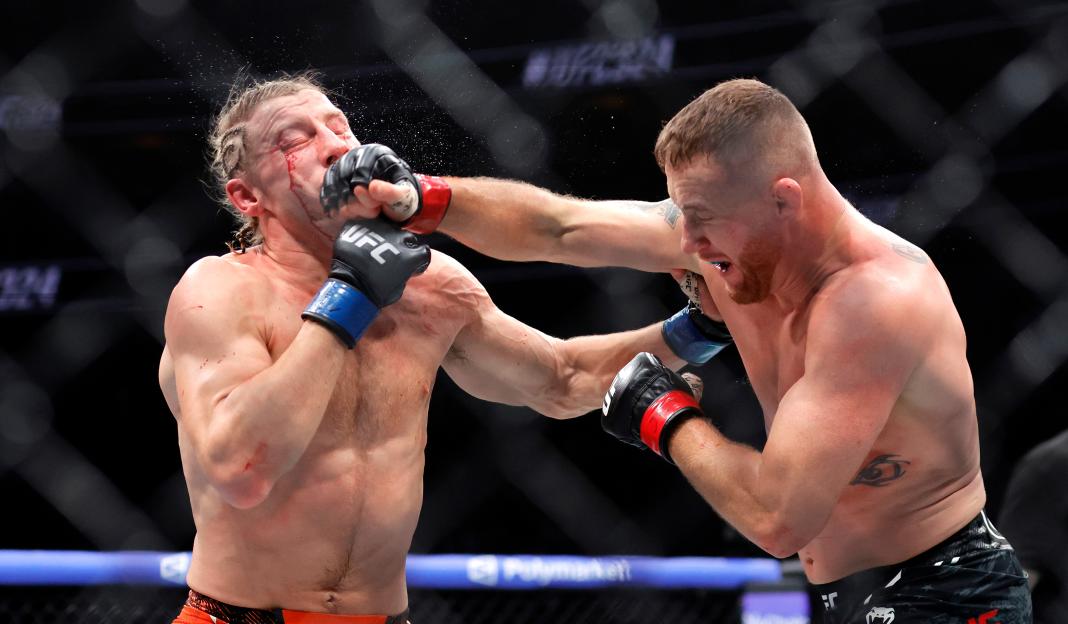 Justin Gaethje punches Paddy Pimblett in an interim lightweight title fight during UFC 324.