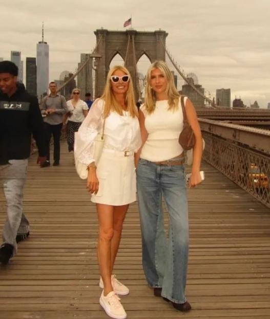 Tess Daly with her daughter Phoebe on a bridge.