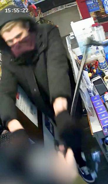CCTV footage showing a shopkeeper fighting off a knife-wielding robber with a walking stick.
