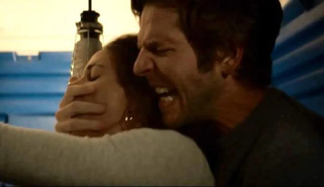 A man yelling and a woman with a hand over her mouth.
