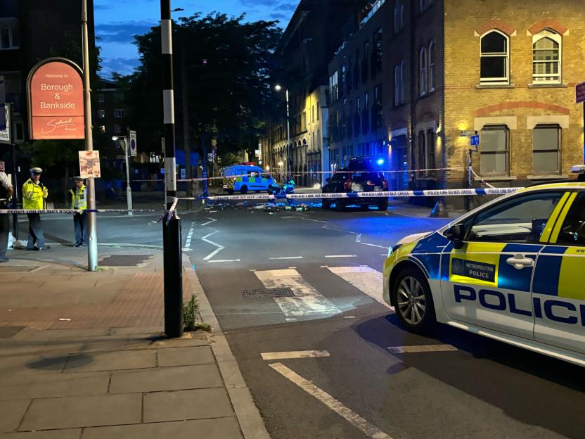 A police car on a street where an accident has occurred.