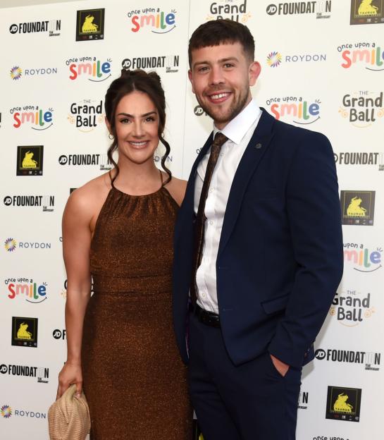 Isabel Hodgins and Adam Whitehead posing at Danny Miller’s annual Once Upon a Smile charity ball.