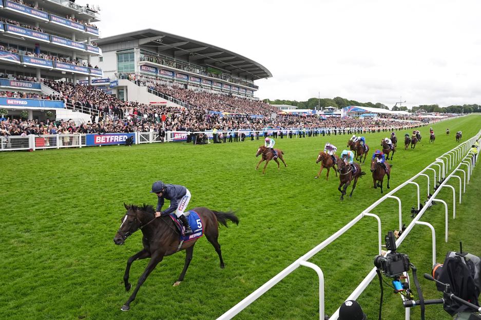 Lambourn ridden by Wayne Lordan winning the Betfred Derby at Epsom Downs Racecourse.