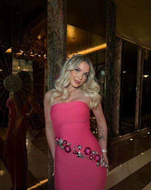 Helen Flanagan in a Barbie pink dress with floral embellishments.