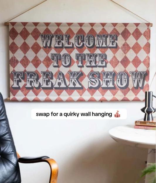 A "Welcome to the Freak Show" circus-themed wall hanging.