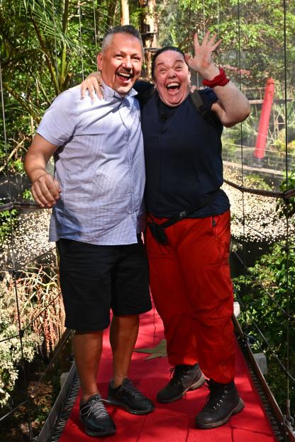 Lisa Riley with her fiancé Al, both smiling broadly, as she is evicted from camp on 'I'm a Celebrity... Get Me Out of Here!'