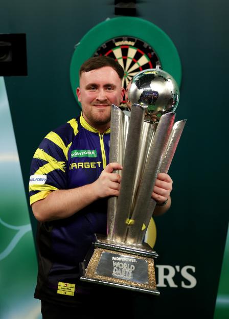 Luke Littler of England poses with the Sid Waddell trophy after the 2025/26 Paddy Power World Darts Championship Final.