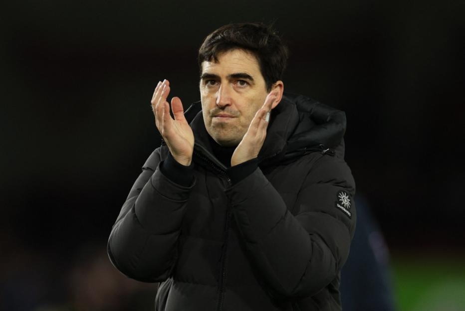 AFC Bournemouth manager Andoni Iraola applauds on the sidelines.
