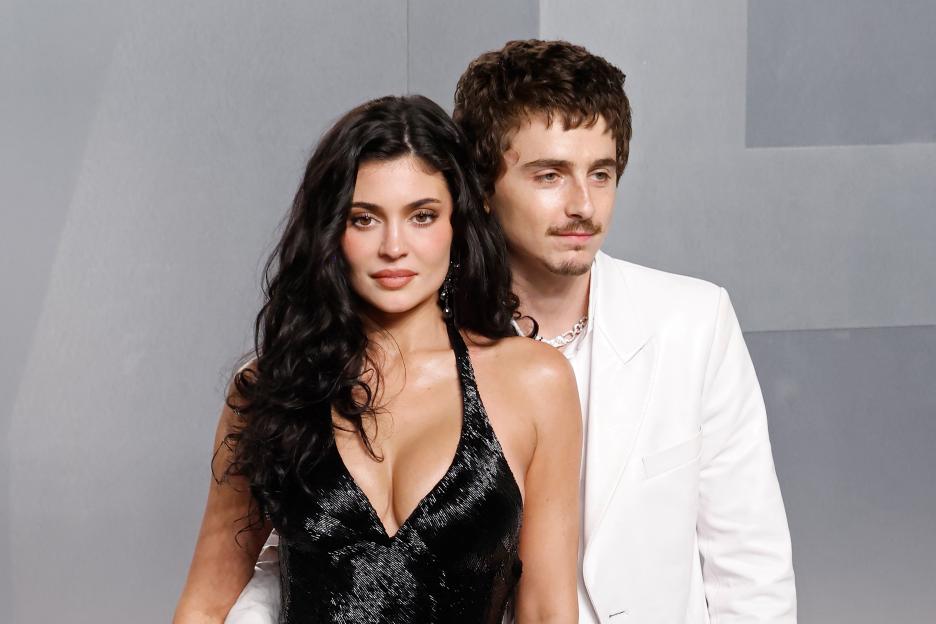 Kylie Jenner in a black sequined dress with Timothée Chalamet in a white suit.