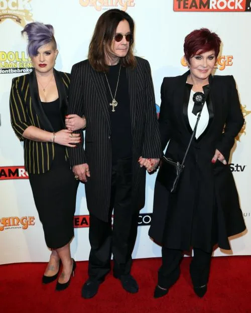 Kelly, Ozzy, and Sharon Osbourne pose together on the red carpet at the 10th Annual Classic Rock Awards.