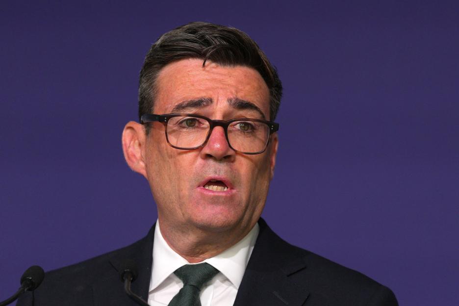 Andy Burnham speaking at a memorial event.