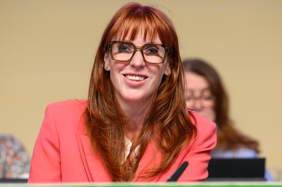 Angela Rayner smiling and wearing glasses at the Unison Conference.
