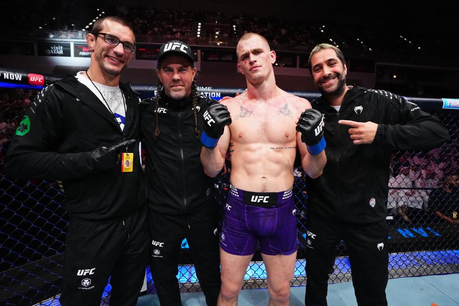 Ian Machado Garry celebrates his victory against Belal Muhammad with his team at UFC Fight Night in Qatar.