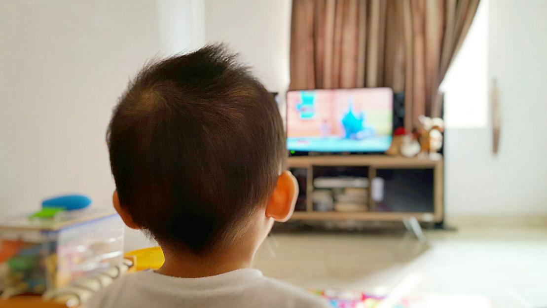 A child watches TV in Sawangan, Indonesia.