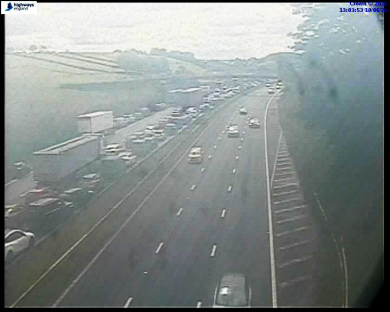 Live traffic camera view of the M6 motorway at junction 35 showing congestion.