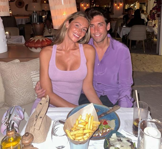 James Argent and Nicoline Artursson smiling together at a restaurant table.