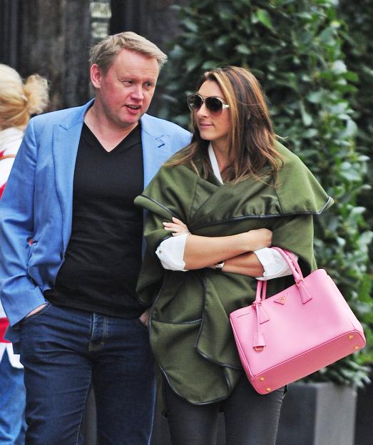 Luisa Zissman and Andrew Collins walking together.