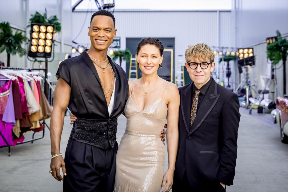 Johannes Radebe, Emma Willis, and Josh Widdicombe smiling and posing for a photo.