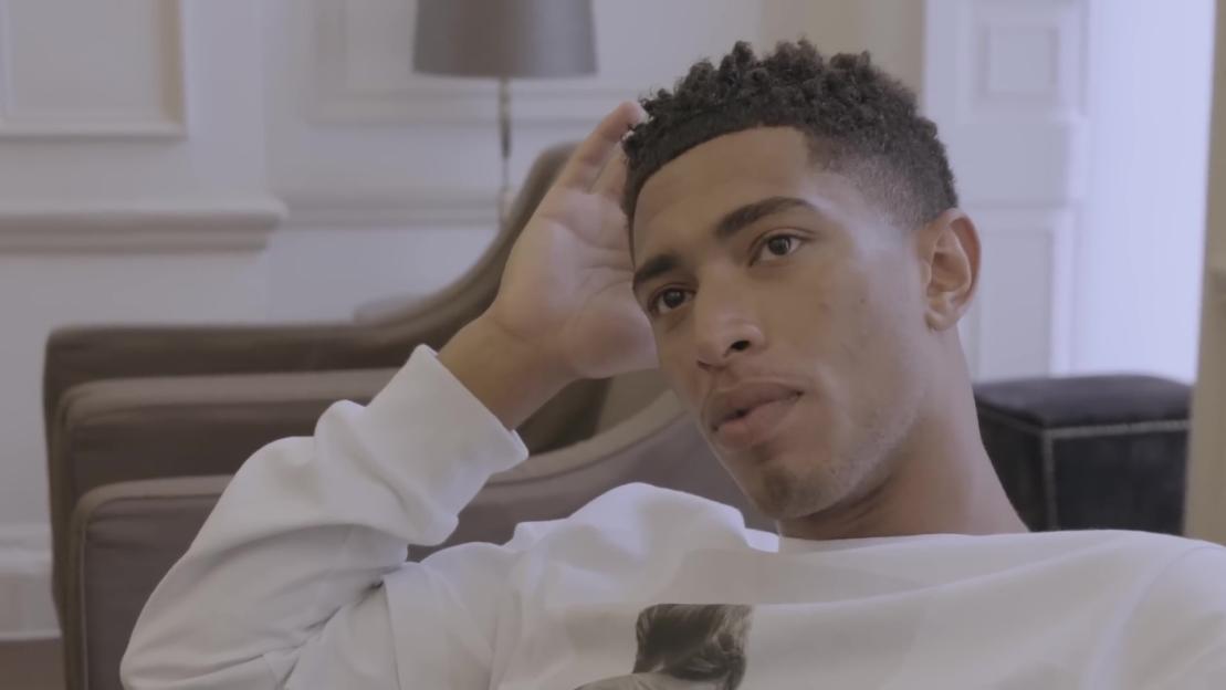 Jude Bellingham relaxing in a chair.