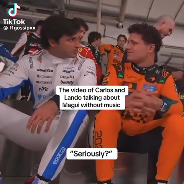 Carlos Sainz Jr. and Lando Norris speaking while sitting, wearing racing suits.