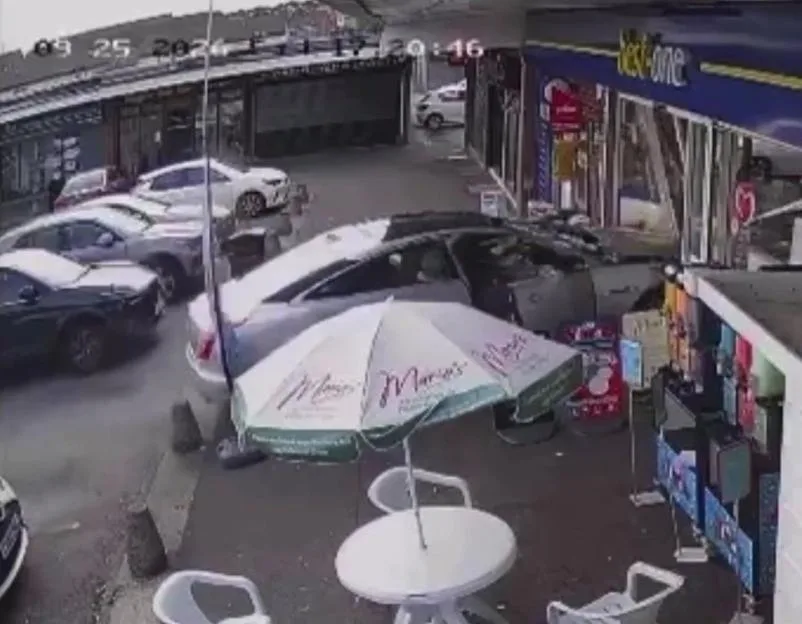 Shock moment customer smashes Jaguar into infamous viral corner shop where nan was left dangling by shutter