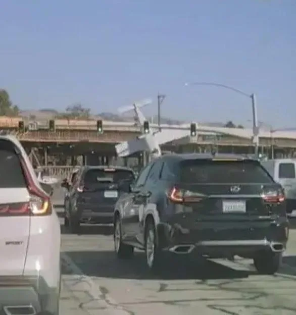 Dramatic moment plane smashes into bridge & nosedives onto motorway during emergency landing with child on board