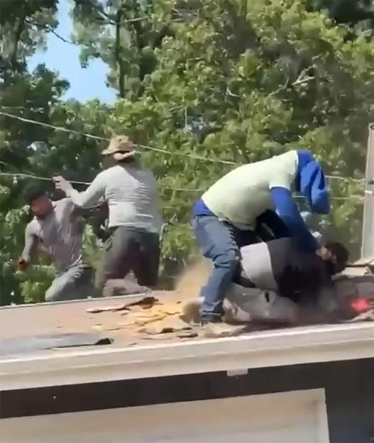 Massive Roofer Brawl Erupts: Man Tossed from Roof as Others Continue Fighting on the Ground!
