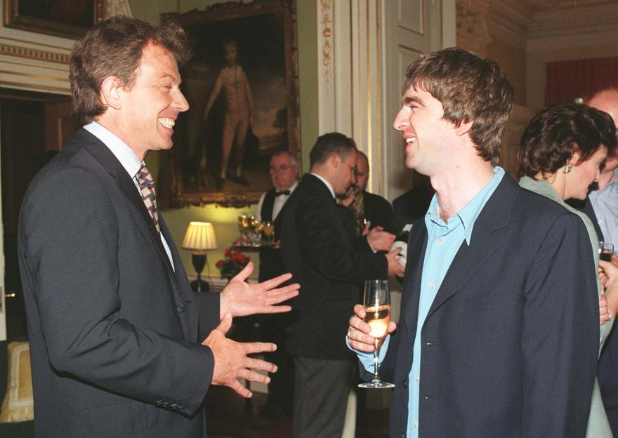 Prime Minister Tony Blair speaking with Oasis star Noel Gallagher at a reception at No.10 Downing Street.