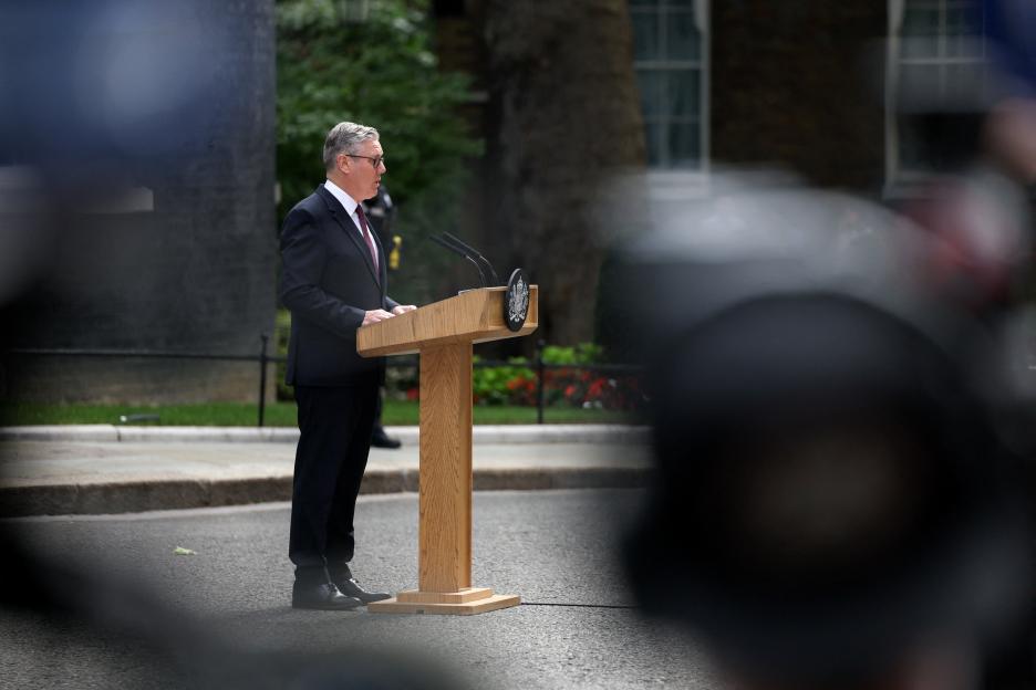 British Prime Minister Keir Starmer speaking at a podium outside 10 Downing Street to announce his resignation.