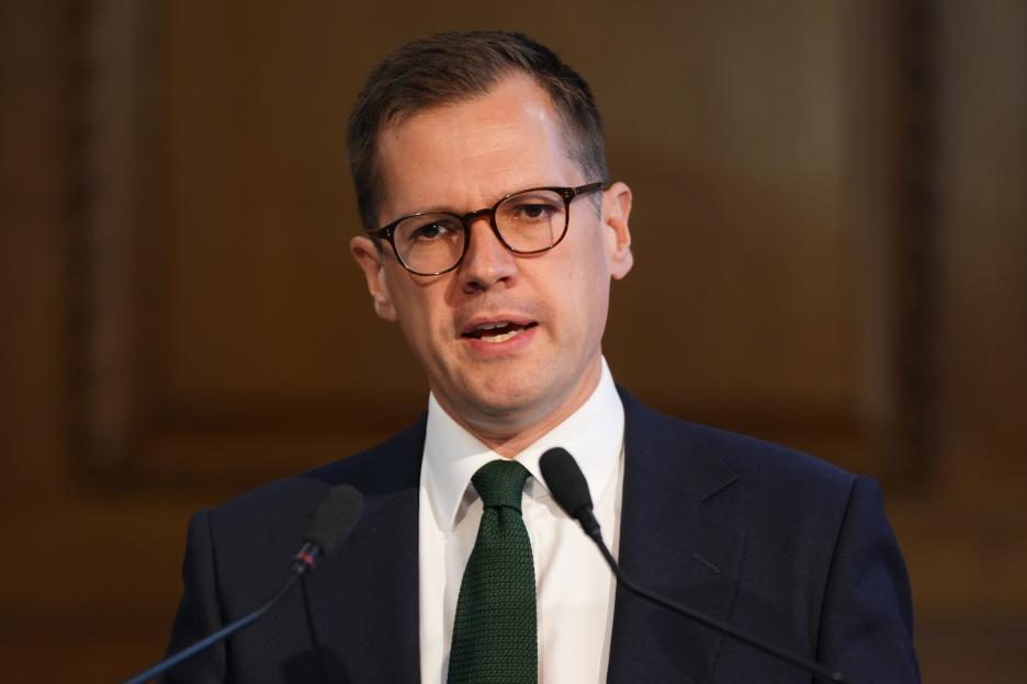 Robert Jenrick speaking on social care during a press conference.