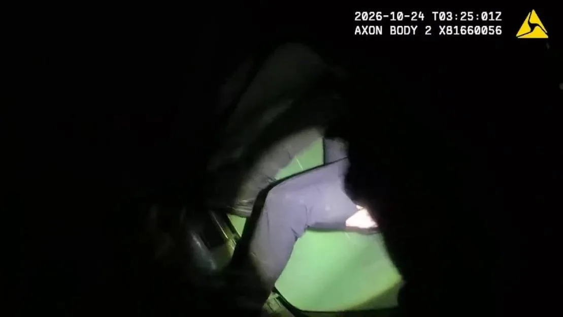 Police body-cam footage of a teenager emerging from inside a green wheelie bin.