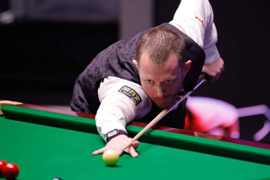 Mark Allen of Northern Ireland plays a shot in the semifinal match at the Halo World Championship 2026.