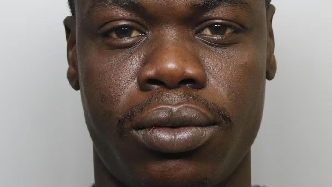Mugshot of Ayman Adam.
