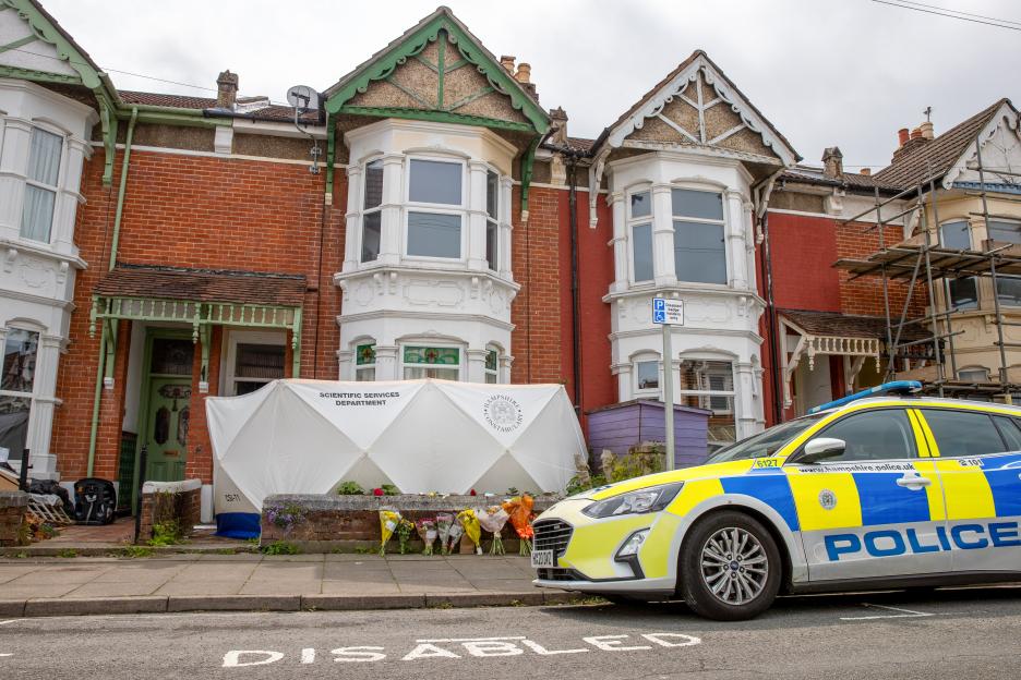 Police car at the scene of a murder investigation in Portsmouth, Hampshire.