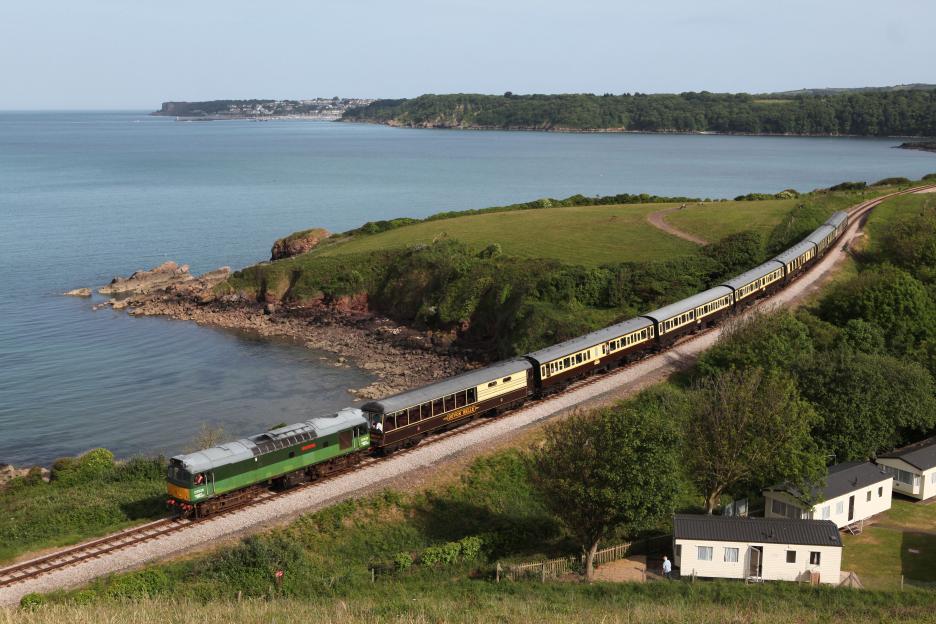 D7535 train passes Saltern Cove with a Kingswear to Paignton train.