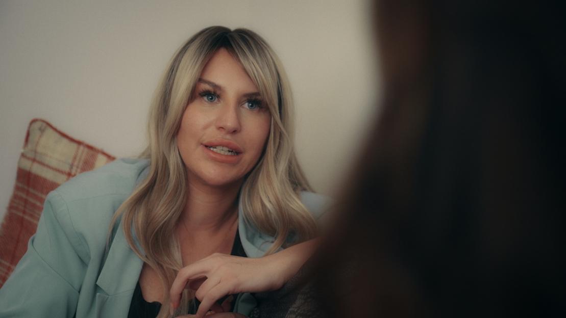 Rebecca from "OnlyFans: Inside the Machine" looking directly into the camera.