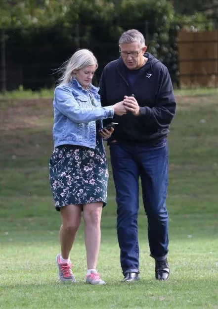 Graeme Hall and Nicola Worth walking together outdoors.