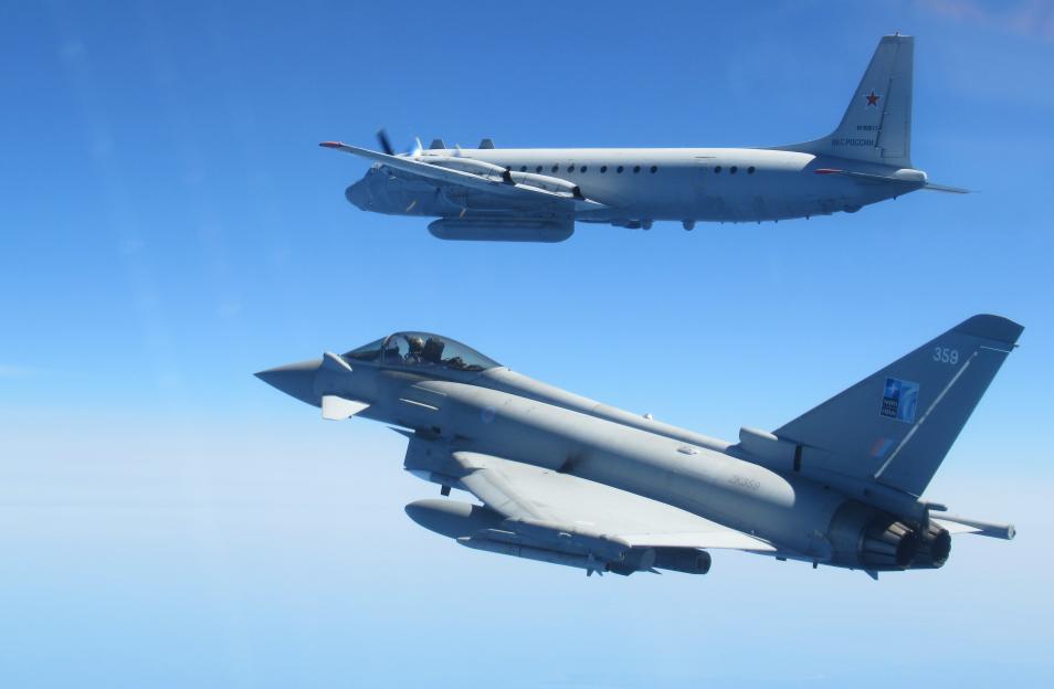 RAF Typhoon fighter jet intercepting a Russian IL-20 COOT A aircraft.