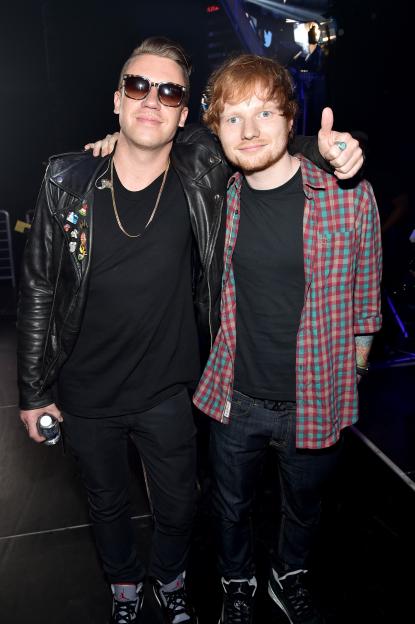 Macklemore and Ed Sheeran pose together at the 2014 iHeartRadio Music Festival.