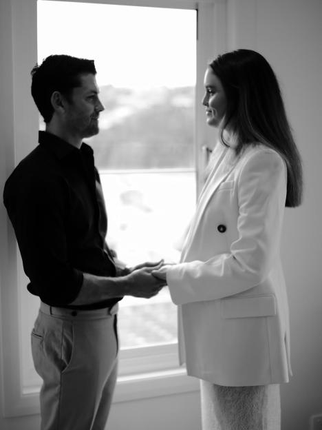 Jackson Heywood and Anneliese Zanchetta holding hands and facing each other.