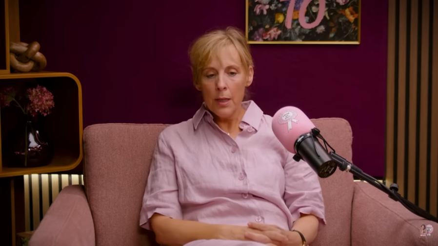 Mel Giedroyc speaking into a pink microphone with "How To Fail" written on it.