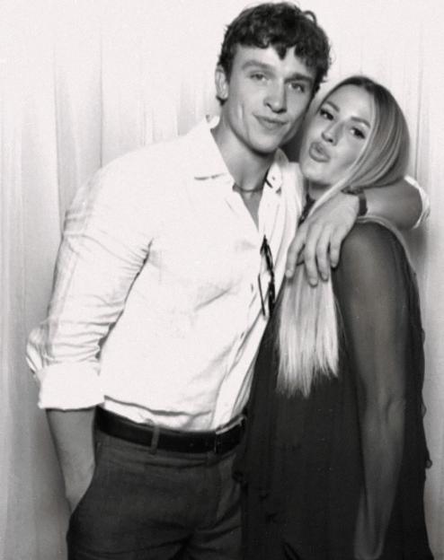 Ellie Goulding and Beau Minniear posing together.