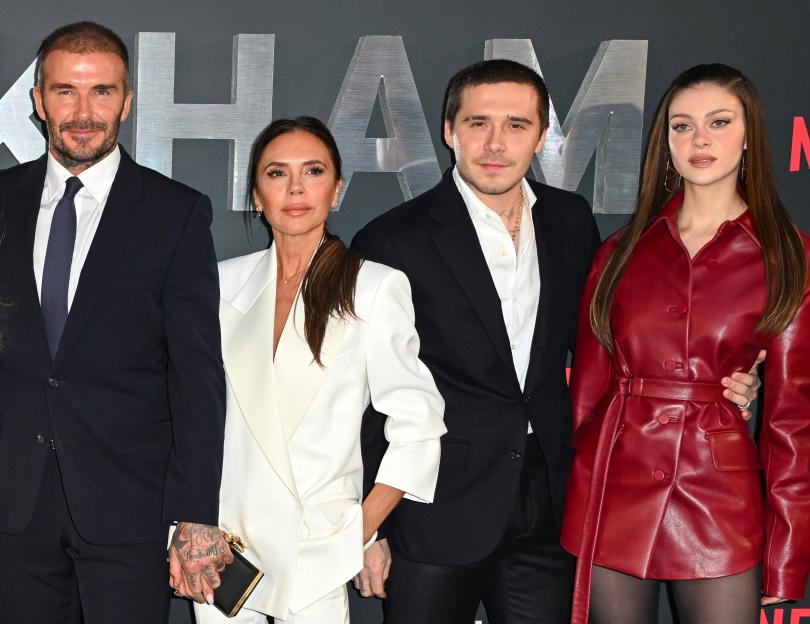 David Beckham, Victoria Beckham, Brooklyn Beckham, and Nicola Peltz posing together.