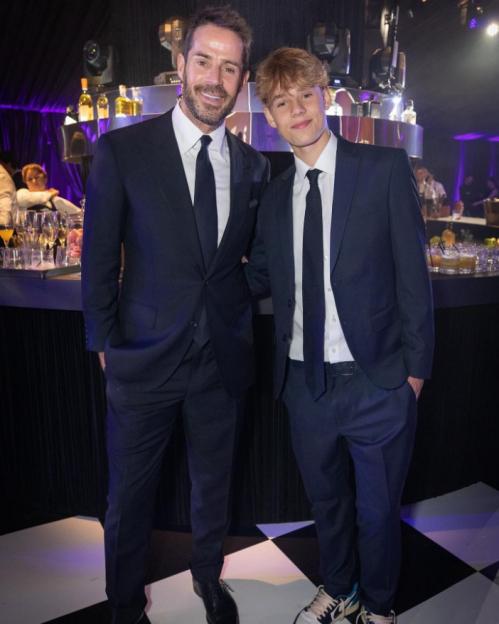 Jamie Theakston with his son at a party.